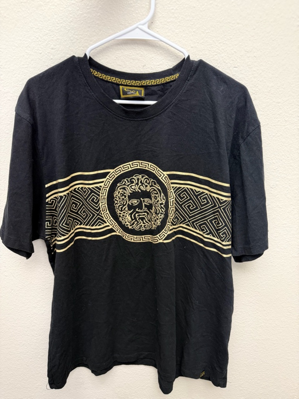 Black Short-Sleeve Graphic Tee with Gold Medallion